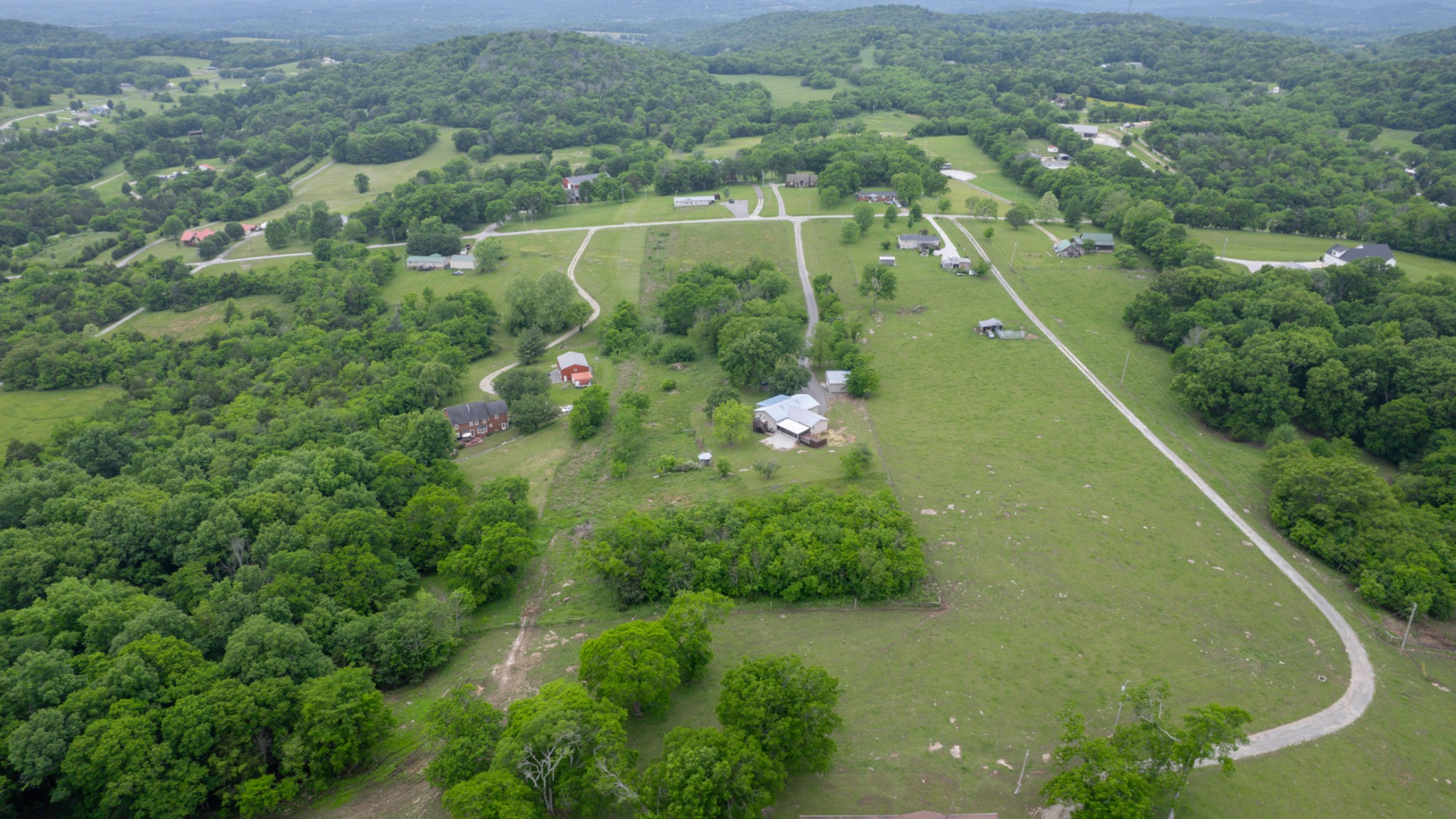 75 Vantrease Road Brush Creek, TN 38547 - Photo 30 of 34 an aerial view of residential houses with outdoor space and trees