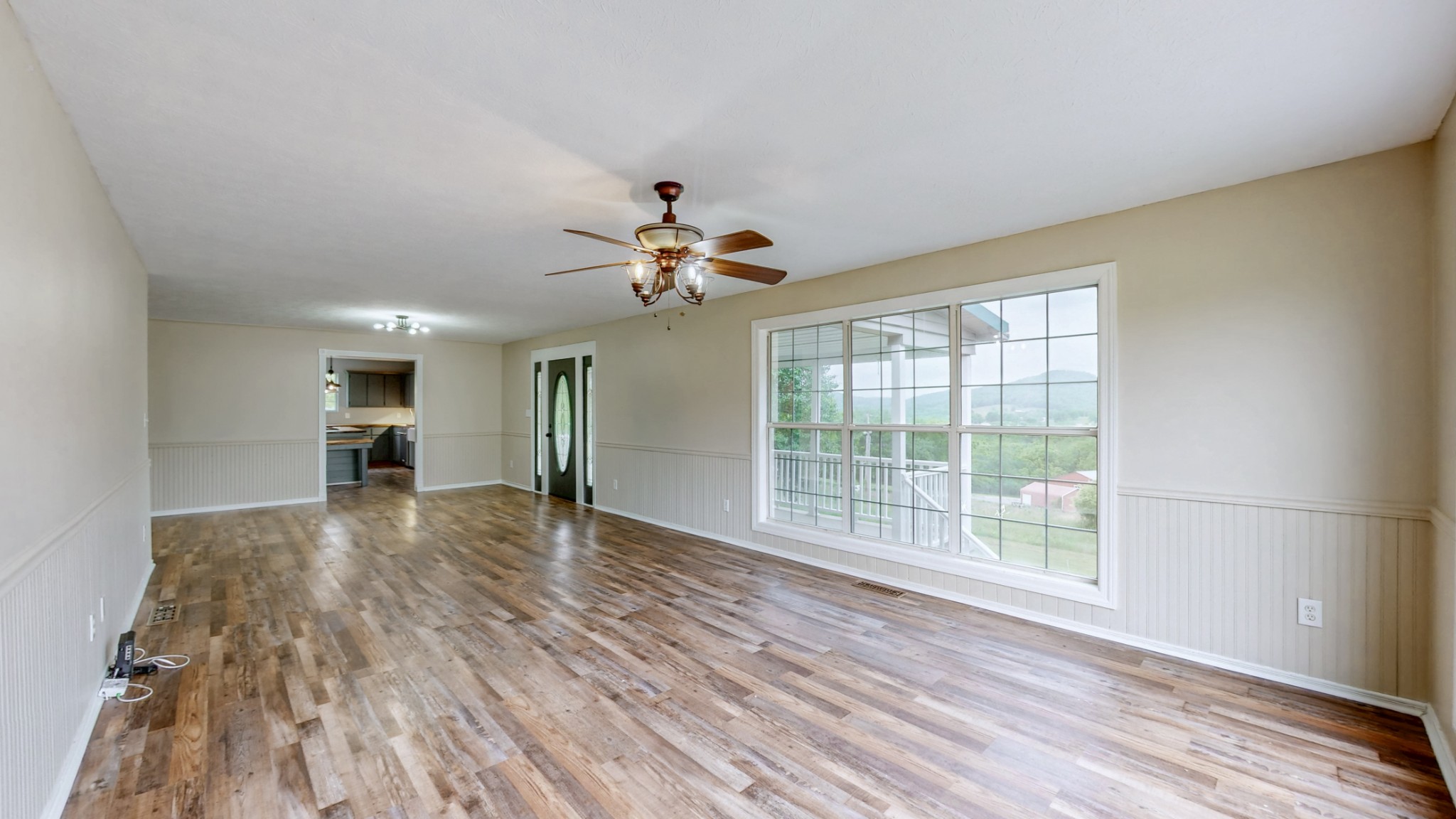 75 Vantrease Road Brush Creek, TN 38547 - Photo 3 of 34 a view of empty room with wooden floor and fan