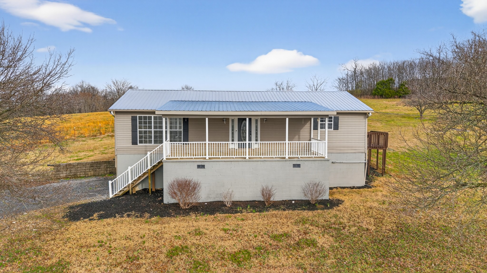 75 Vantrease Road Brush Creek, TN 38547 - Photo 4 of 72 a front view of a house with a yard