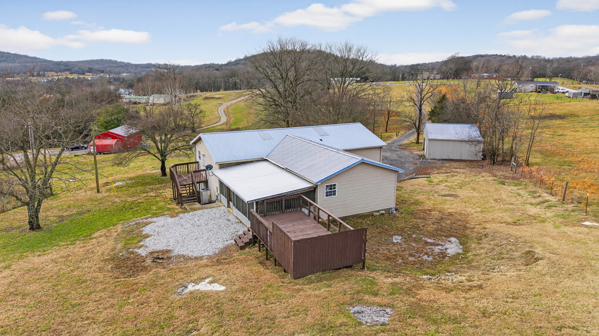 75 Vantrease Road Brush Creek, TN 38547 - Photo 59 of 72 an aerial view of a house with a garden and lake view