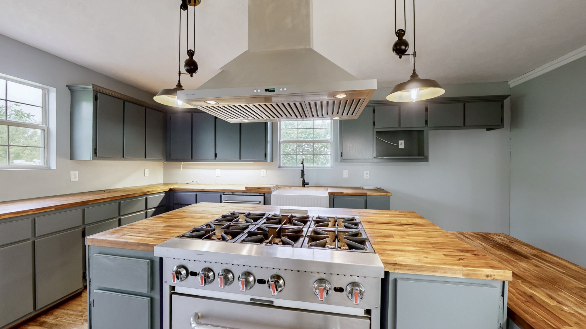 75 Vantrease Road Brush Creek, TN 38547 - Photo 8 of 34 a kitchen with a stove and a chandelier