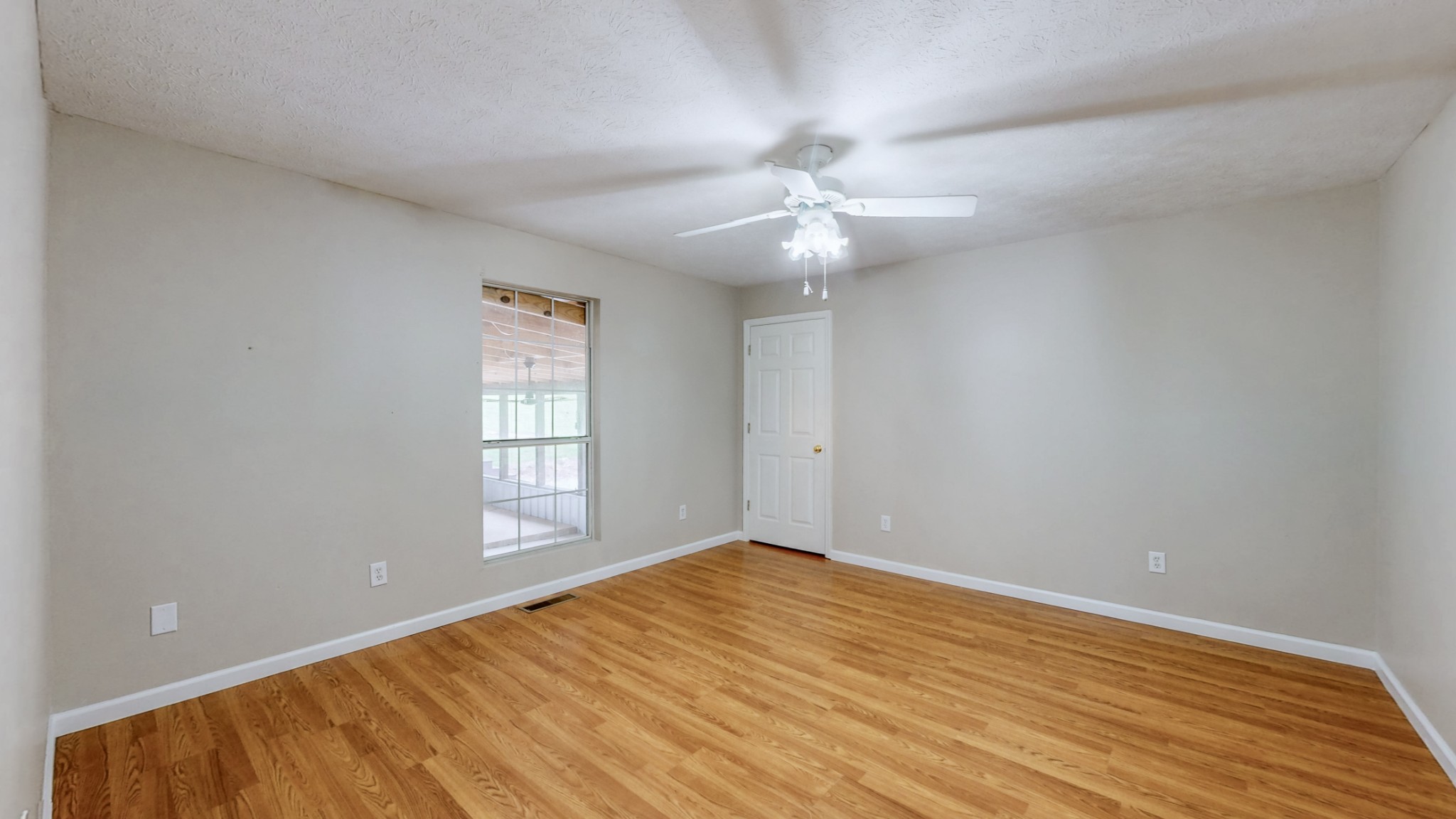 75 Vantrease Road Brush Creek, TN 38547 - Photo 9 of 34 wooden floor in an empty room with a window