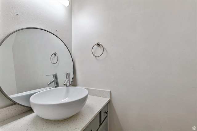 38 South 1000th Street East Payson, UT 84651 - Photo 12 of 19 Modern vessel sink with chrome faucet, set on a speckled countertop