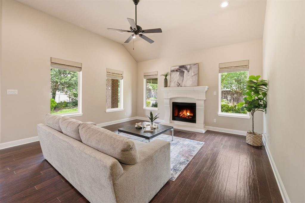 7013 Handel Colleyville, TX 76034 - Photo 17 of 37 Living space featuring a vaulted ceiling and wood-finish flooring