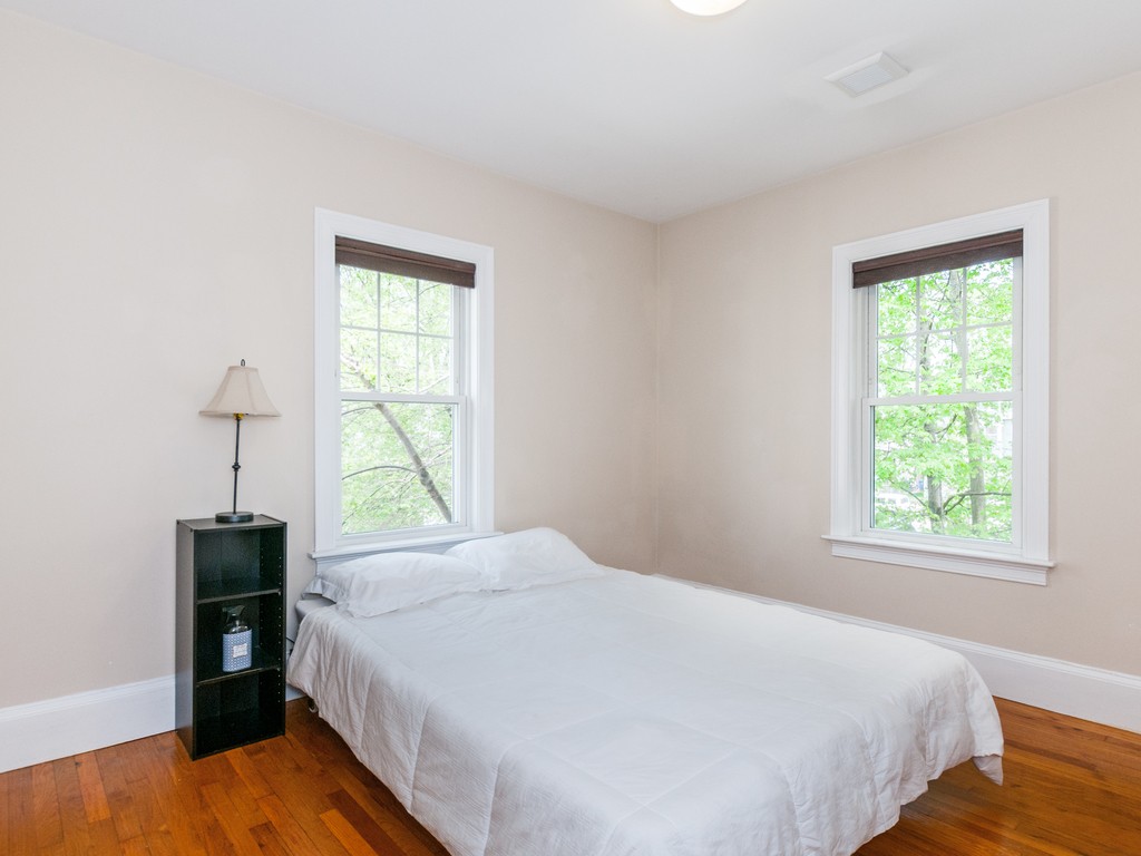 15 Banks Street, Unit 4 Waltham, MA 02451 - Photo 15 of 19 a bedroom with a bed and a window