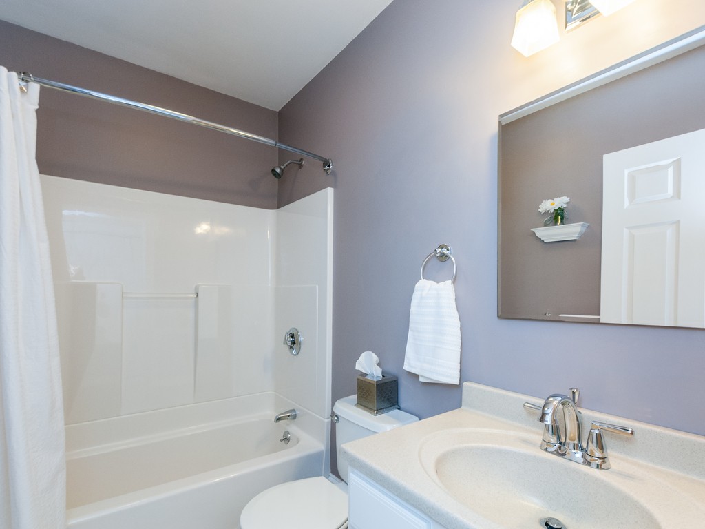 15 Banks Street, Unit 4 Waltham, MA 02451 - Photo 16 of 19 a bathroom with a sink toilet and shower