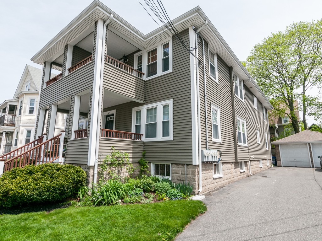 15 Banks Street, Unit 4 Waltham, MA 02451 - Photo 2 of 19 a front view of a house with a garden