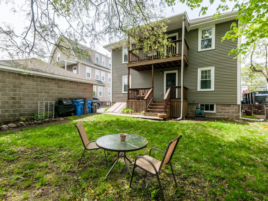 15 Banks Street, Unit 4 Waltham, MA 02451 - Photo 3 of 19 a view of a chair and table in backyard of the house