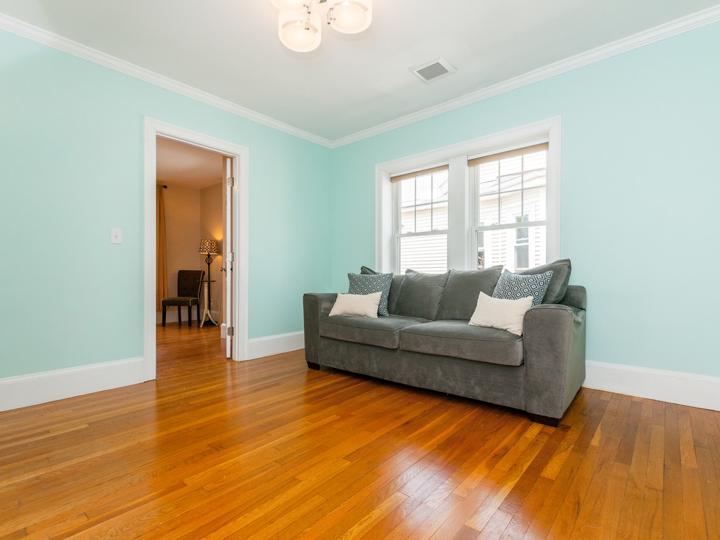 15 Banks Street, Unit 4 Waltham, MA 02451 - Photo 7 of 19 a living room with furniture and a wooden floor