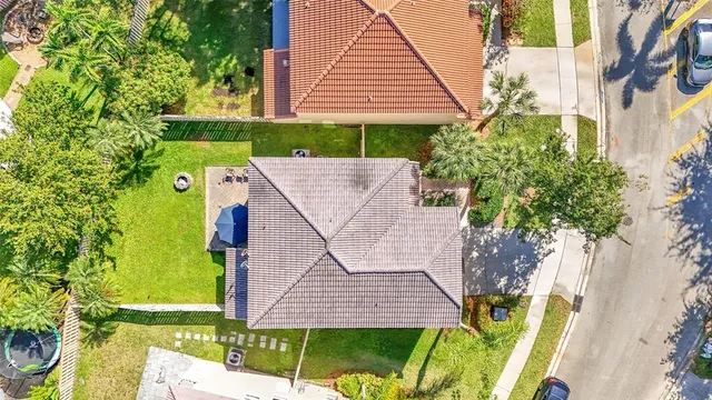 a aerial view of a house with a yard