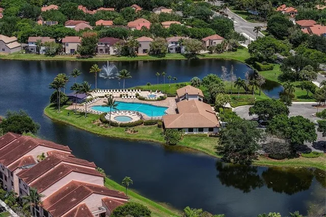 an aerial view of a house with a lake view