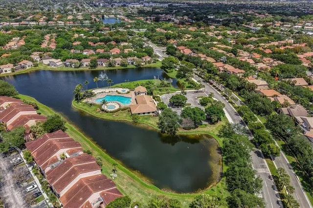 an aerial view of a house with a lake view