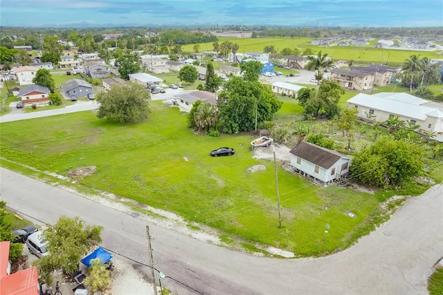 an aerial view of a residential houses with outdoor space
