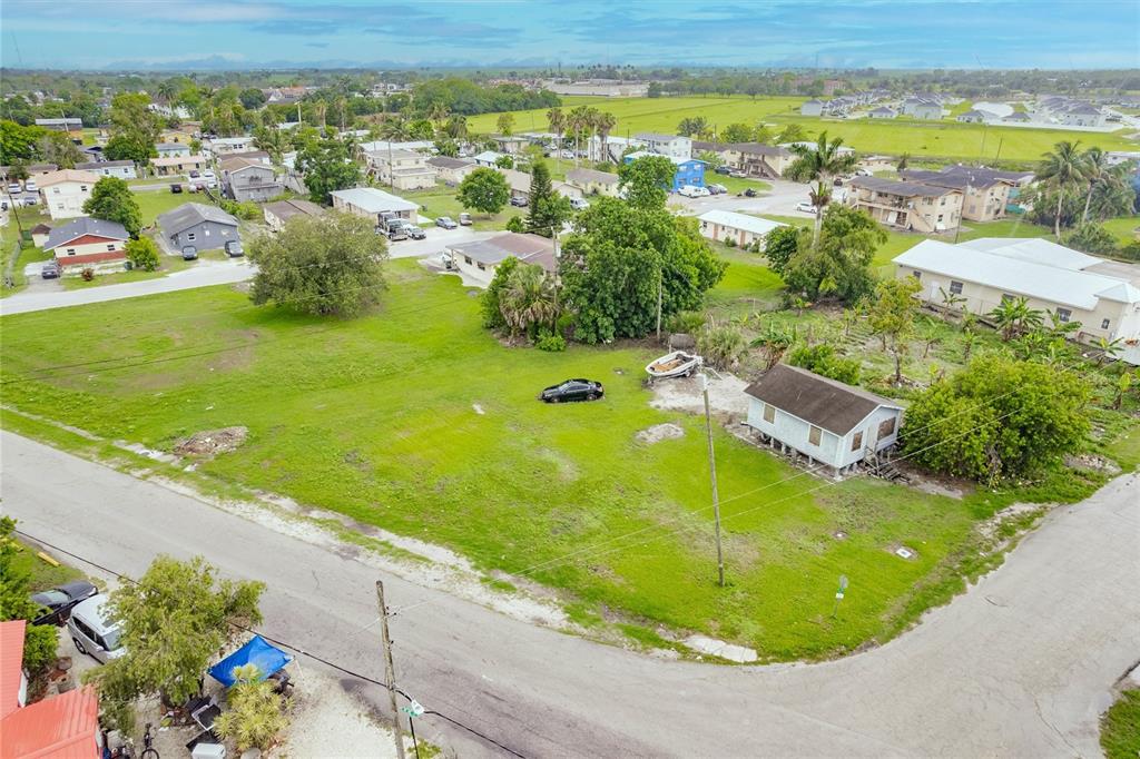 601 Southwest 6th Street Belle Glade, FL 33430 - Photo 4 of 7 a view of a swimming pool with a yard