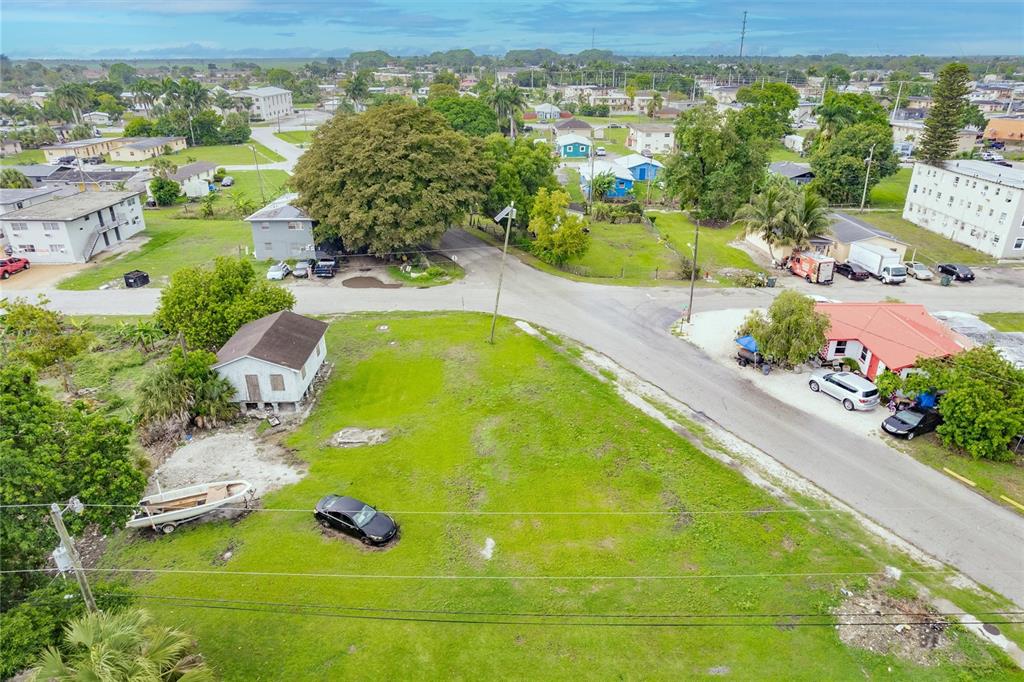 601 Southwest 6th Street Belle Glade, FL 33430 - Photo 6 of 7 an aerial view of residential houses with outdoor space and swimming pool