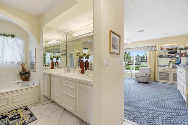 a view of swimming pool with outdoor seating and plants