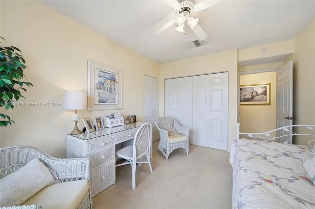 a living room with furniture a rug and a fireplace