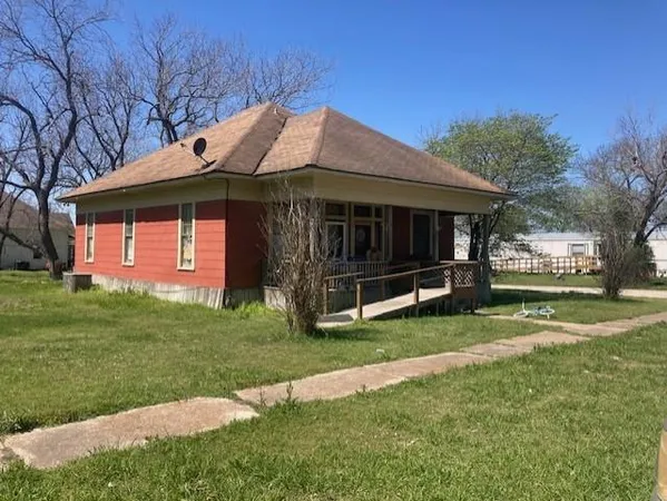 a view of a house with a garden
