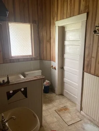 a bathroom with a sink and a window