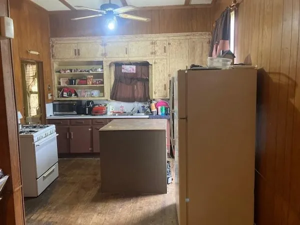 a utility room with cabinets dryer and washer