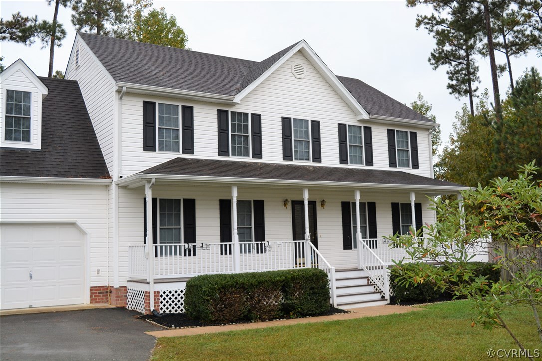 5437 Hackney Road Richmond, VA 23234 - Photo 1 of 50 a front view of a house with a yard