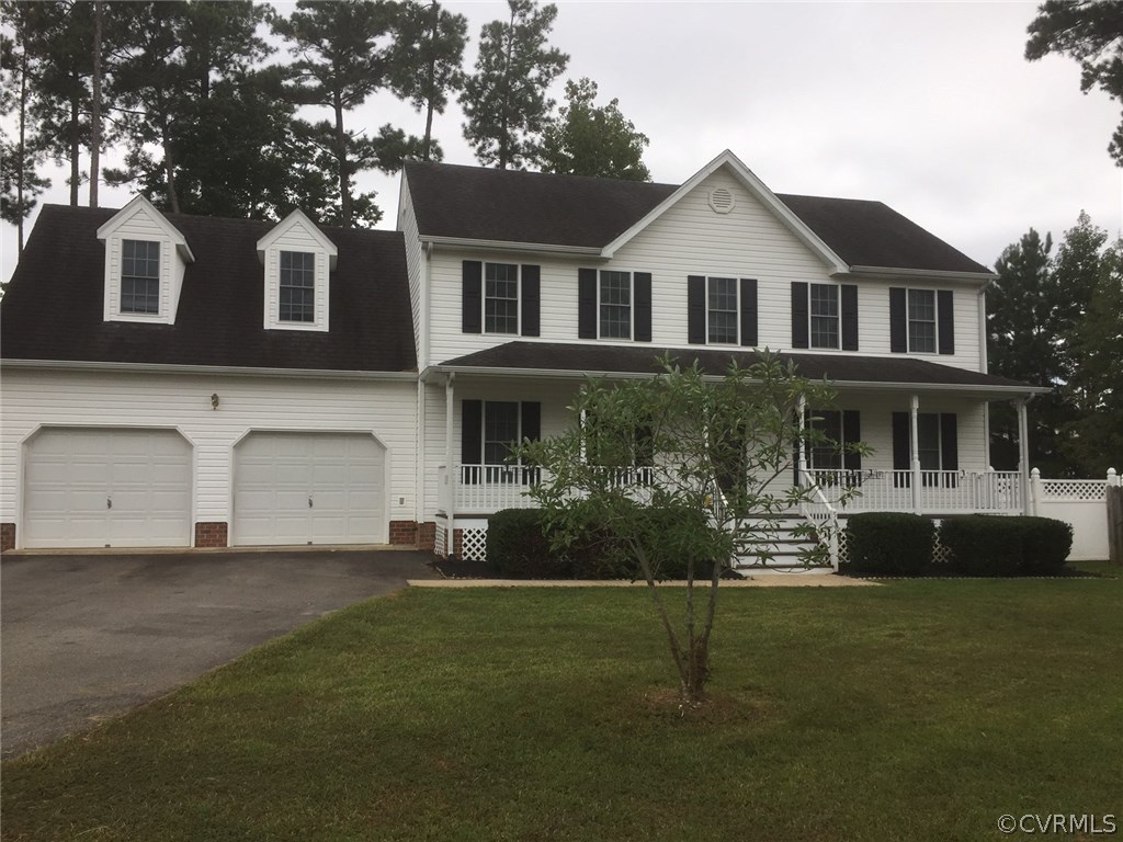 5437 Hackney Road Richmond, VA 23234 - Photo 4 of 50 a front view of a house with a yard