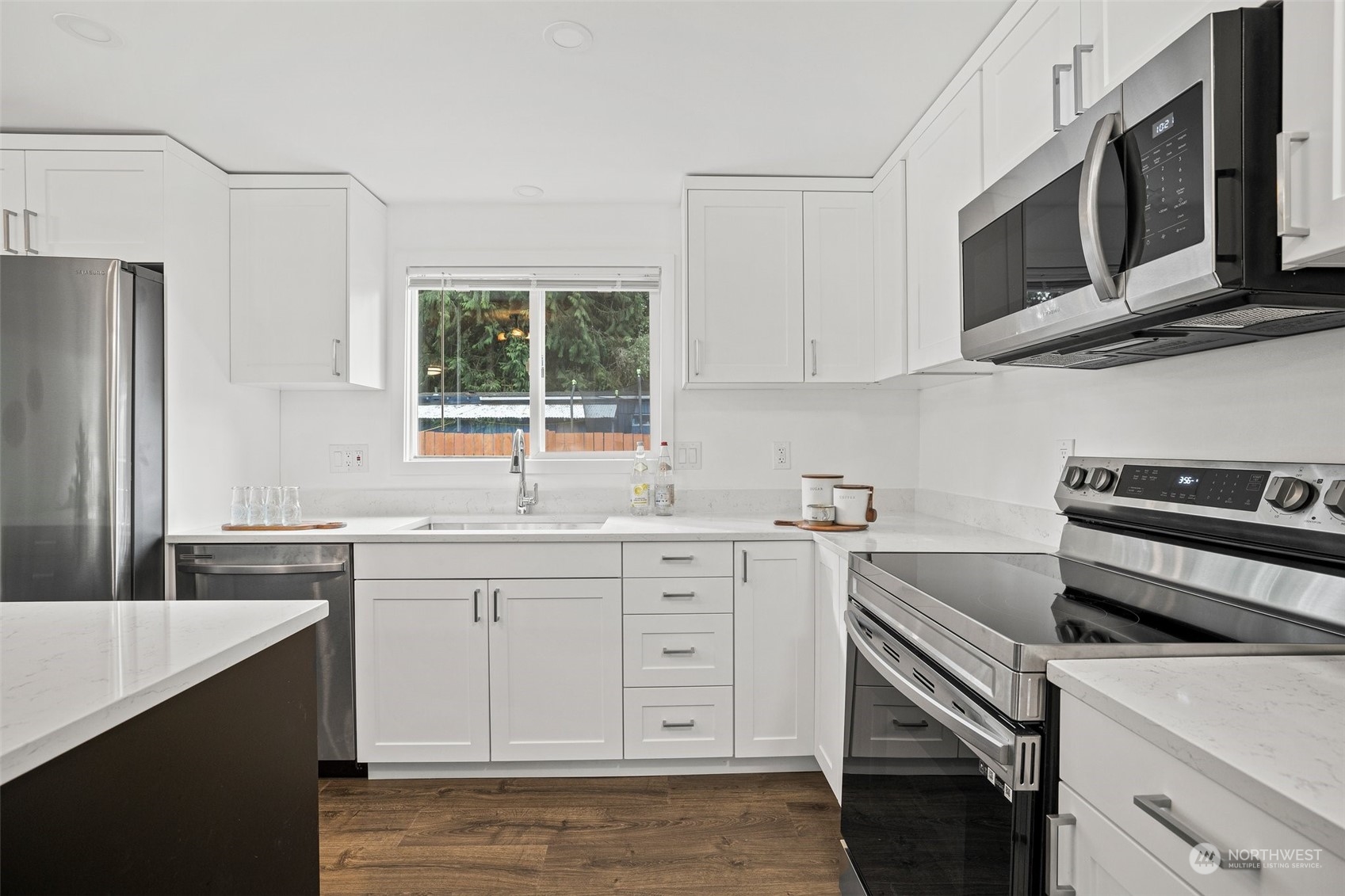 12031 2nd Drive Southeast Everett, WA 98208 - Photo 11 of 27 a kitchen with a sink stove and microwave