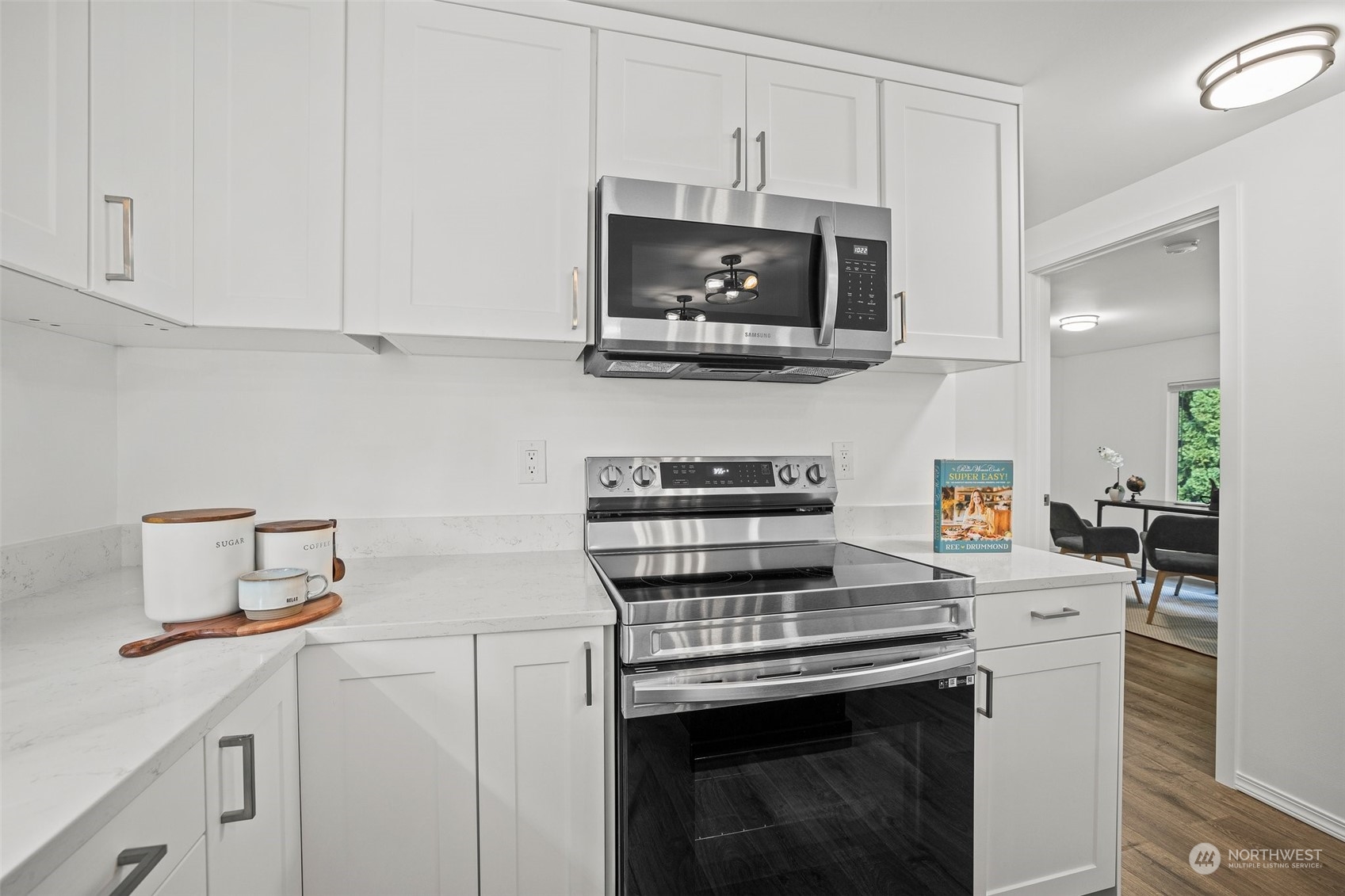 12031 2nd Drive Southeast Everett, WA 98208 - Photo 13 of 27 a kitchen with white cabinets and stainless steel appliances