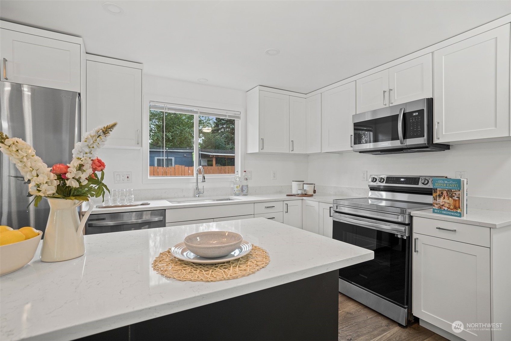 12031 2nd Drive Southeast Everett, WA 98208 - Photo 14 of 27 a kitchen with a stove a microwave and cabinets