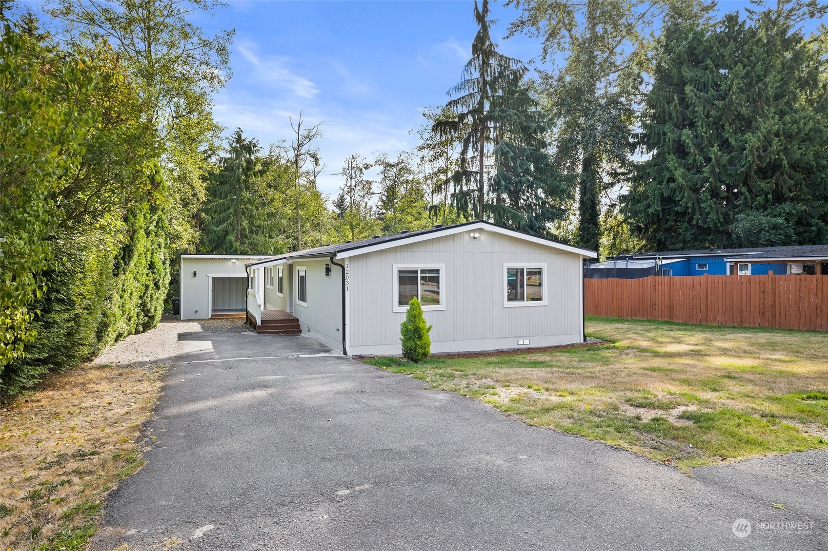 12031 2nd Drive Southeast Everett, WA 98208 - Photo 2 of 27 a view of a house with backyard and trees