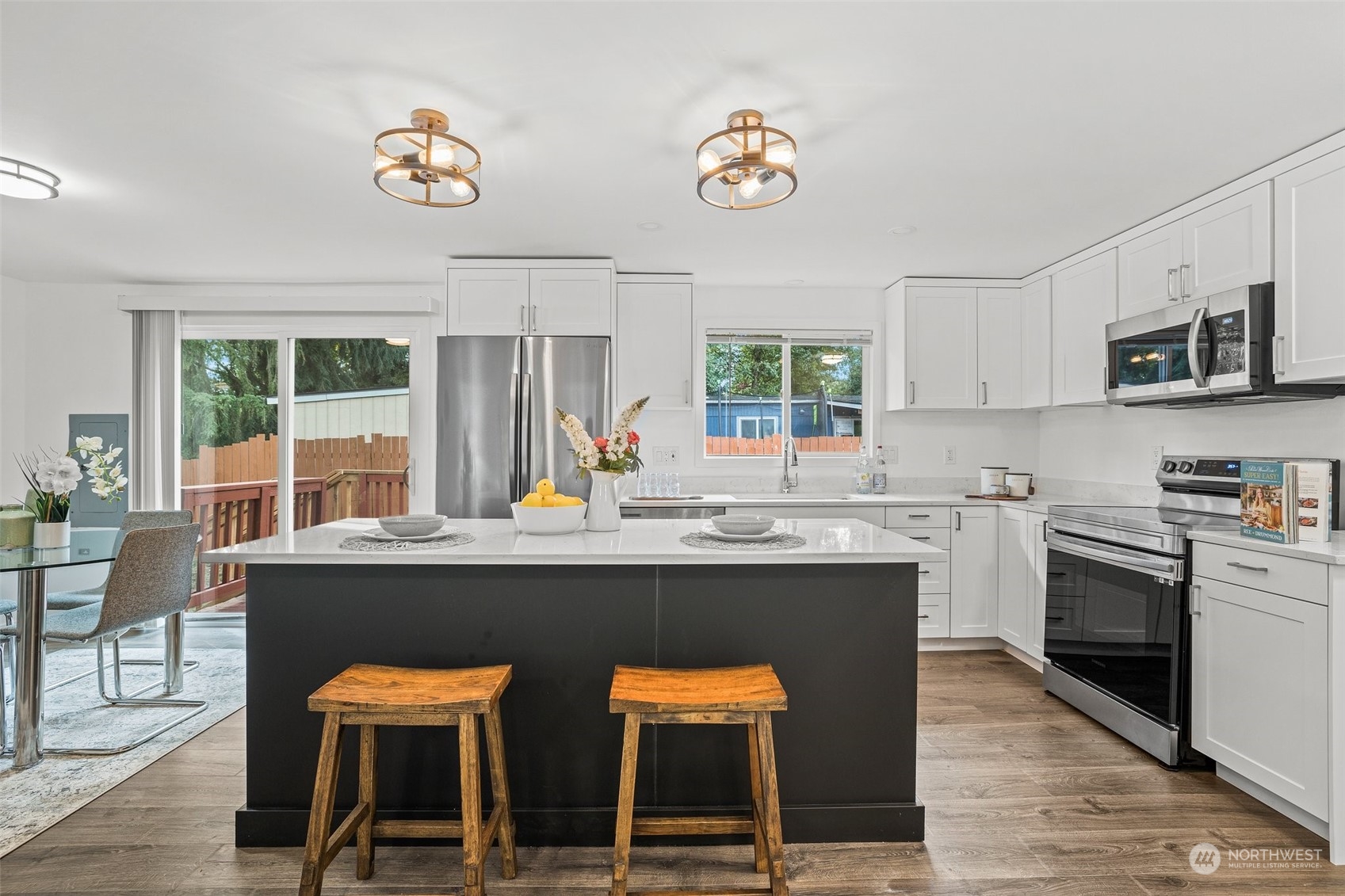 12031 2nd Drive Southeast Everett, WA 98208 - Photo 10 of 27 a kitchen with kitchen island a stove and a refrigerator