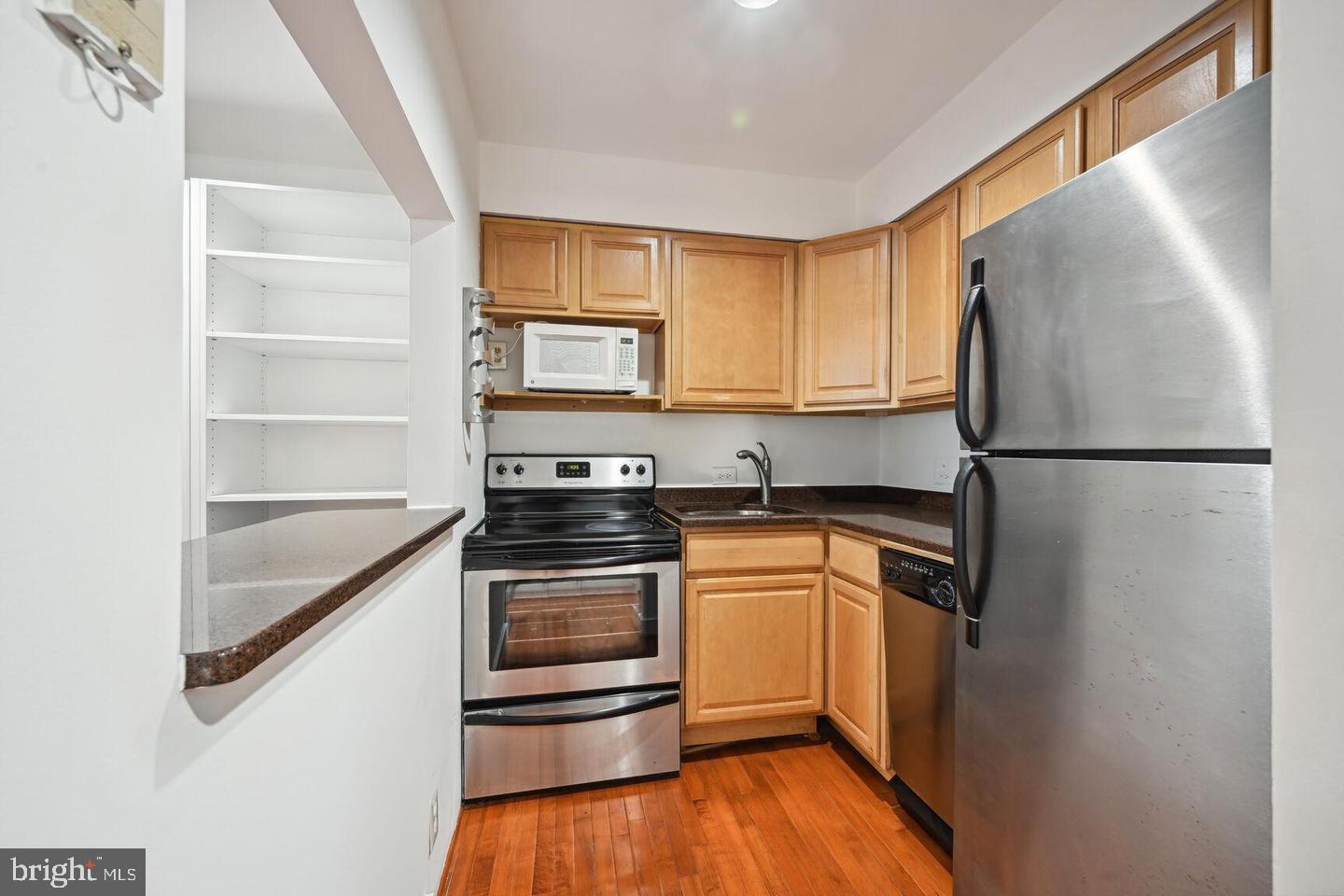 2305 18th Street Northwest, Unit 303 Washington, DC 20009 - Photo 13 of 21 Charming kitchen with modern finishes.