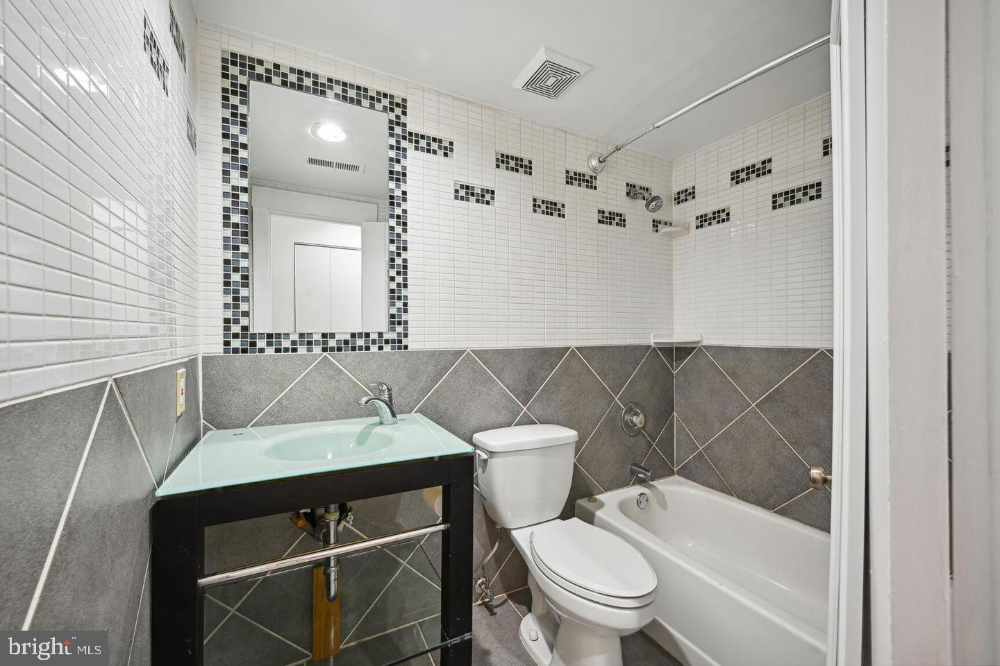 2305 18th Street Northwest, Unit 303 Washington, DC 20009 - Photo 17 of 21 Modern bathroom with stylish tiles.