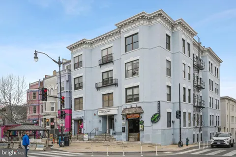 a front view of a building with street view