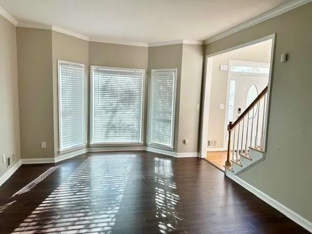 a view of an entryway with wooden floor
