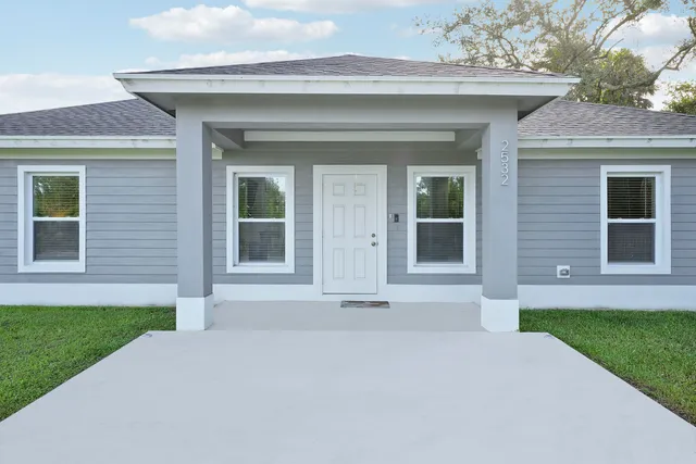 front view of a house with a yard