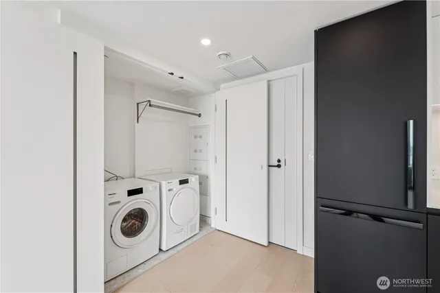 a view of a storage & utility room with washer and dryer