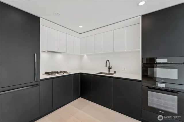 a kitchen with a sink and cabinets