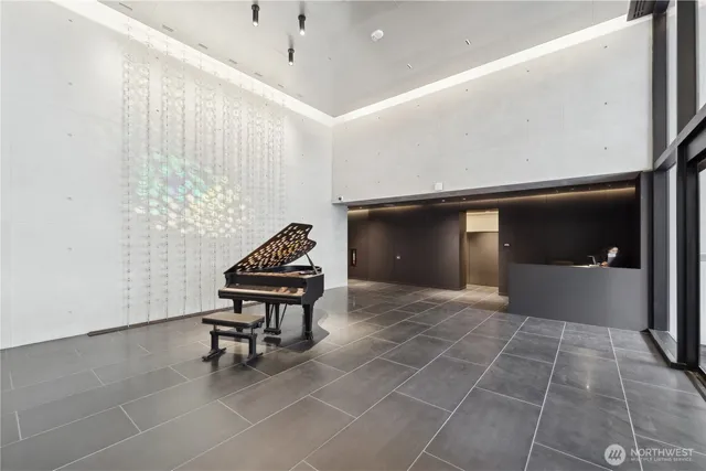 a living room with furniture and a ceiling fan