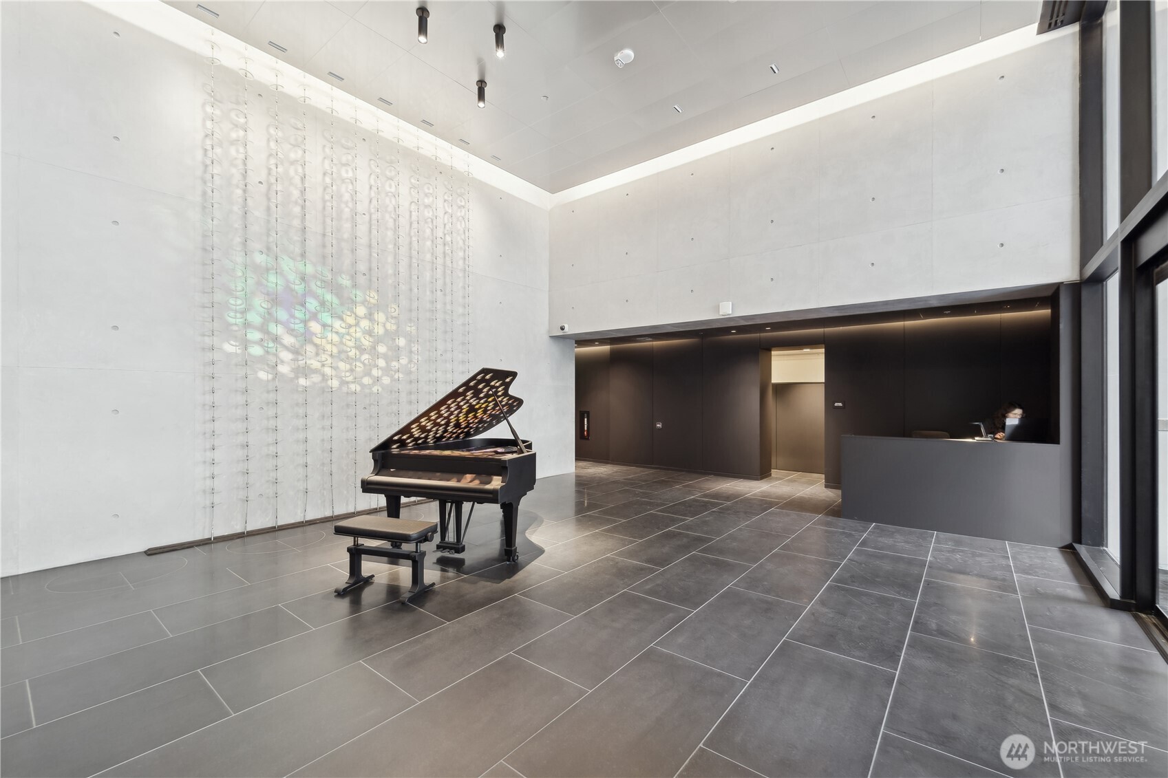 300 Virginia Street, Unit 1411 Seattle, WA 98121 - Photo 22 of 38 a lobby with furniture and rug