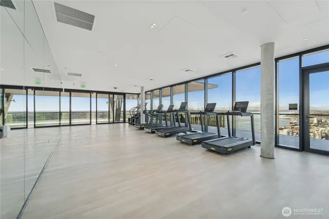 a view of a living room and floor to ceiling window