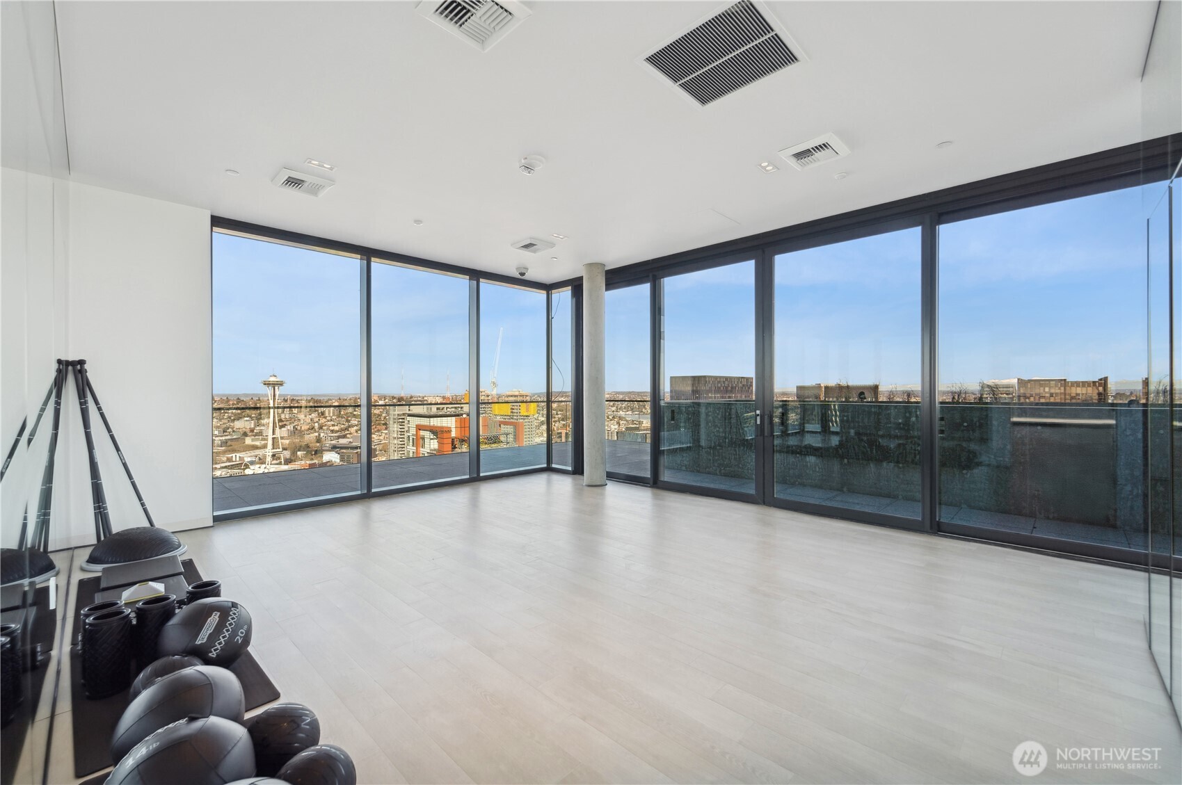 300 Virginia Street, Unit 1411 Seattle, WA 98121 - Photo 29 of 38 a view of a living room and floor to ceiling window
