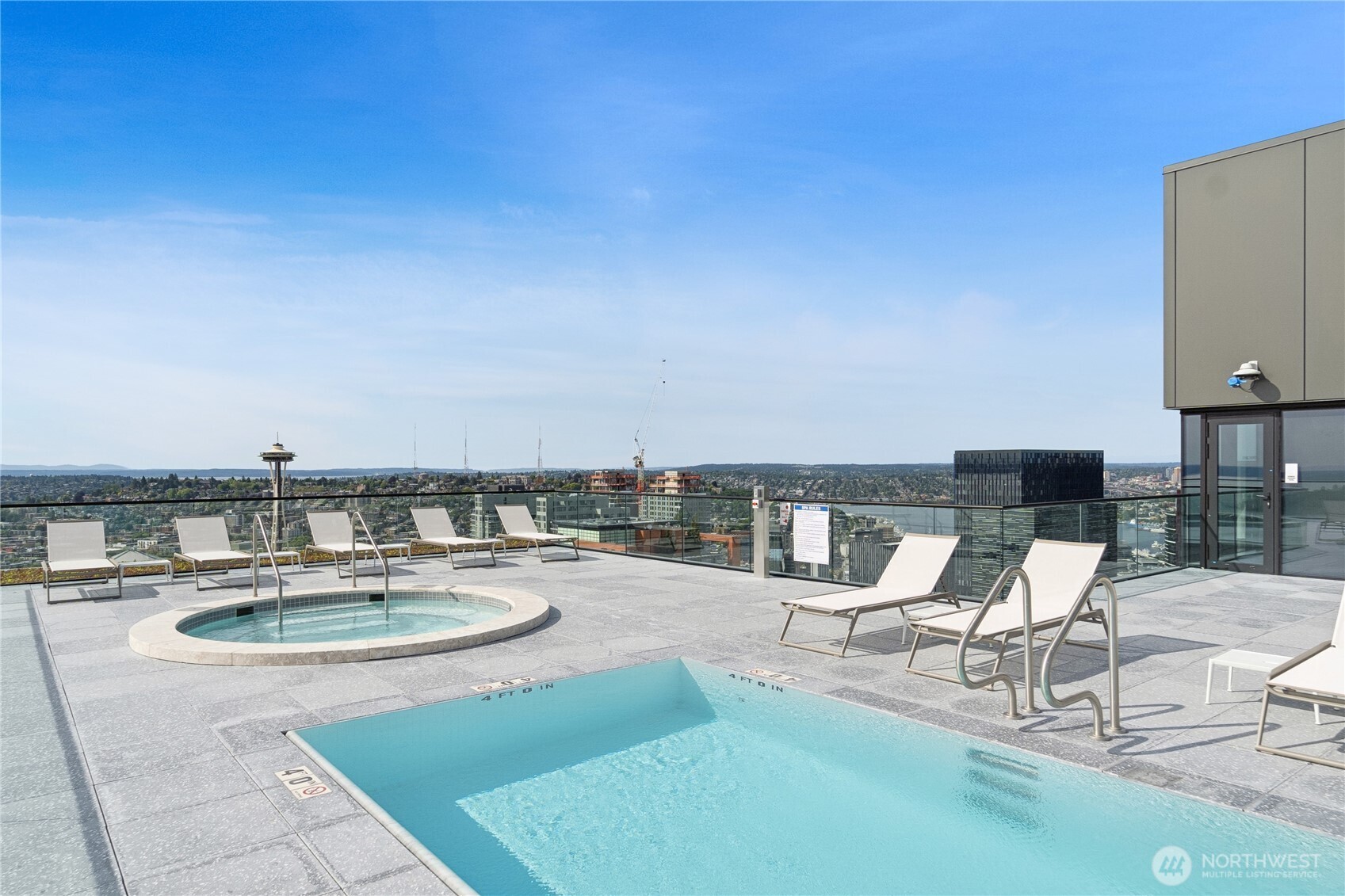 300 Virginia Street, Unit 1411 Seattle, WA 98121 - Photo 34 of 38 a swimming pool with outdoor seating and city view