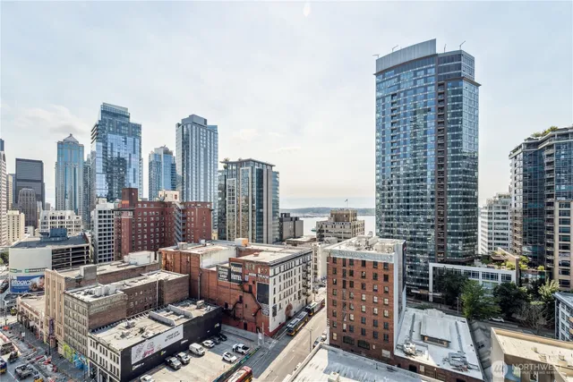 a view of roof with a tall buildings
