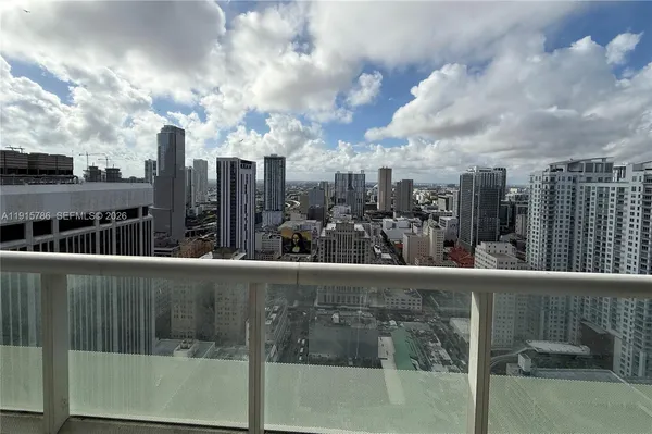 a view of a balcony with city view