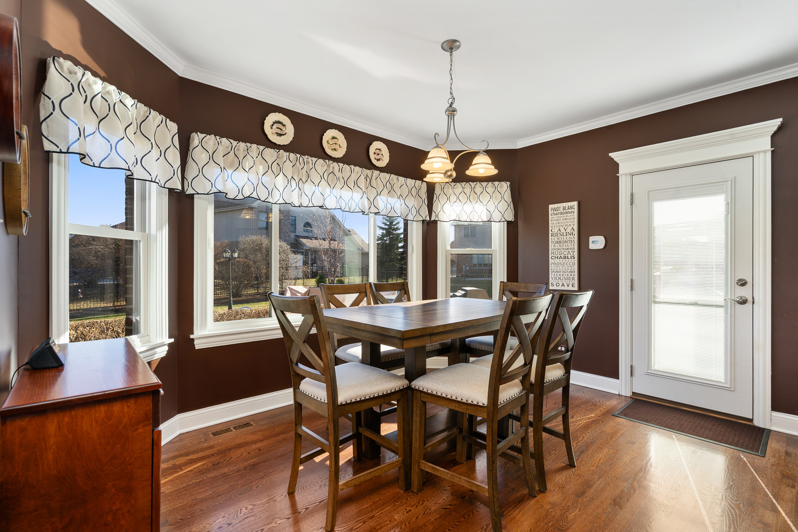 17621 Harper Road Tinley Park, IL 60487 - Photo 13 of 67 a view of a dining room with furniture window and wooden floor