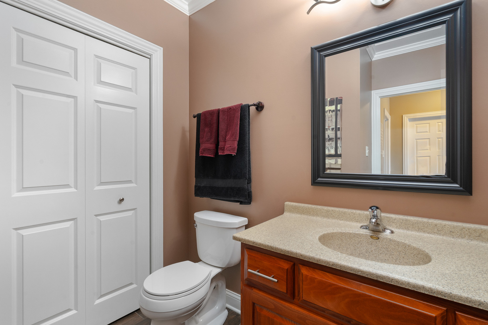 17621 Harper Road Tinley Park, IL 60487 - Photo 20 of 67 a bathroom with a toilet a sink and mirror