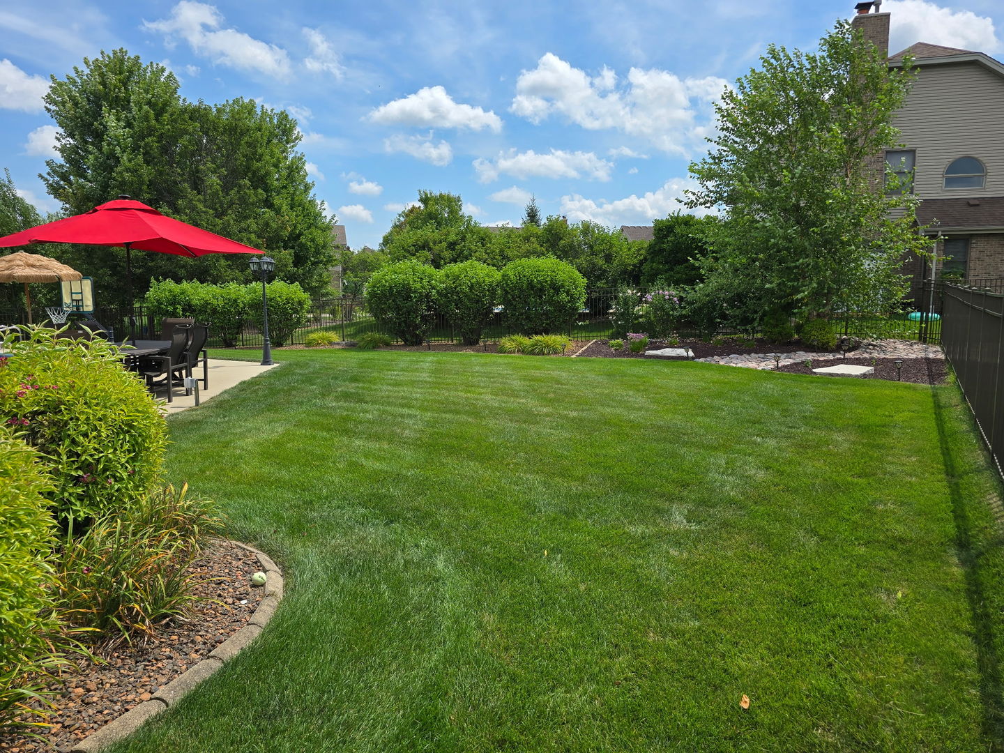 17621 Harper Road Tinley Park, IL 60487 - Photo 48 of 67 a view of a fire pit in front of a house