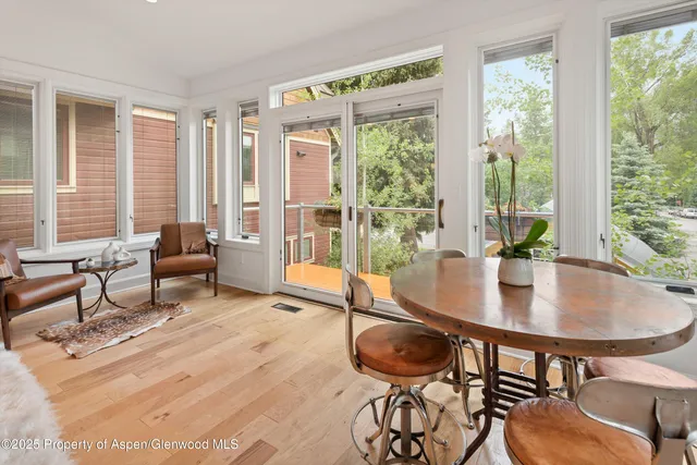 a kitchen with granite countertop white cabinets and stainless steel appliances