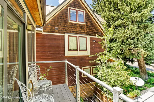 front view of house with a tree